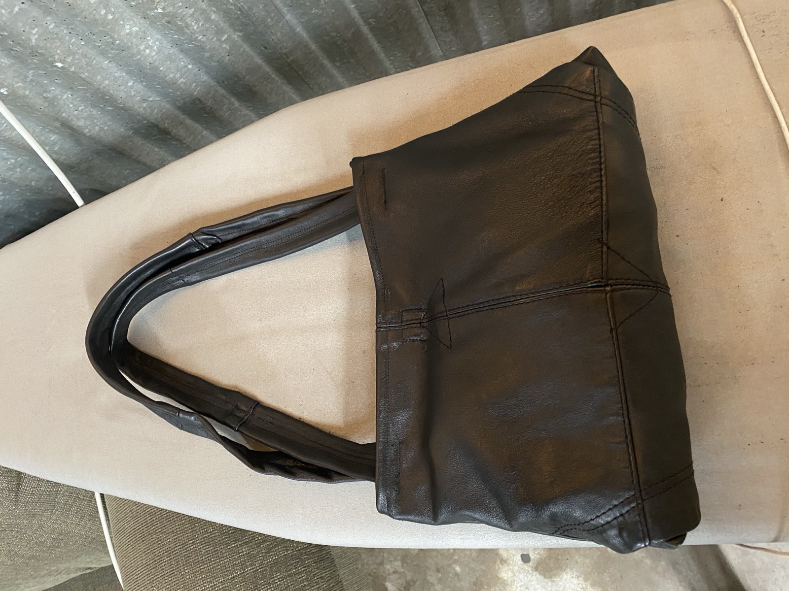 Leather jacket to purse back view